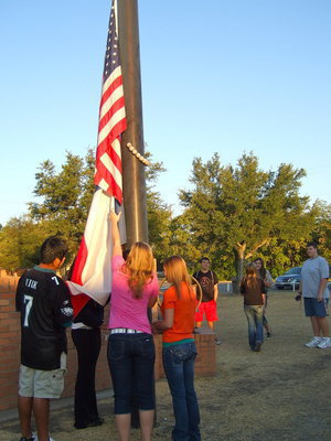 Image: Raising the flag as Taps was being played.