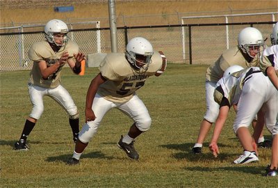 Image: Ryan Connor(17) receives the snap from Brandon Connor(77) as Kenneth Norwod, Jr. looks to block the A-gap.