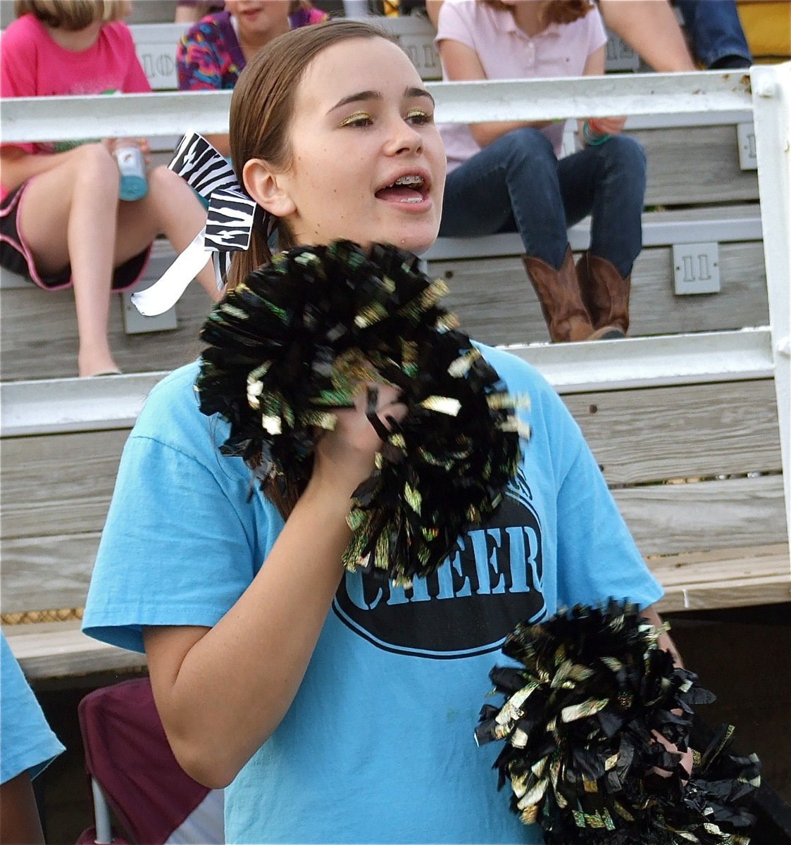 Image: Cheerleader Amber Hooker cheers loud and proud for the Italy Jr. High Gladiators.