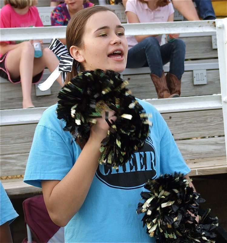 Image: Cheerleader Amber Hooker cheers loud and proud for the Italy Jr. High Gladiators.