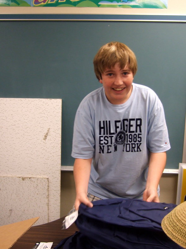 Image: Brent Kirton is busy handing out backpacks to be stuffed.