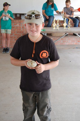 Image: Hunter Hinz, 4th grader at Stafford Elementary in Italy, won the Junior Champion Buckle at the Ellis County 4-H Shooting Sports Fun shoot.