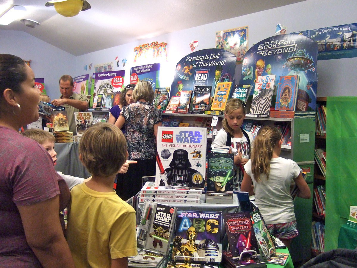 Image: Lots of books and lots of kids.