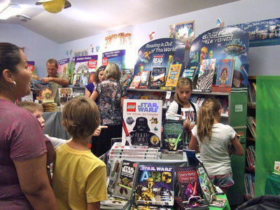 Image: Lots of books and lots of kids.