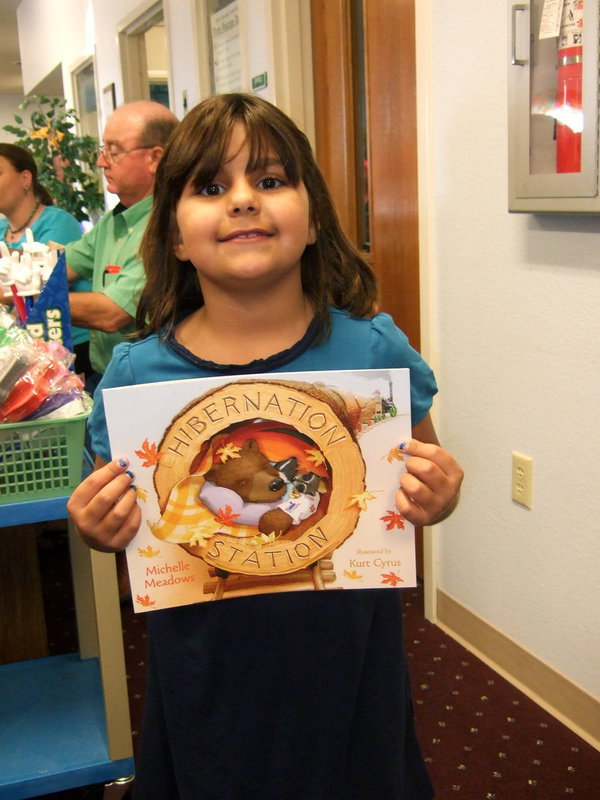 Image: Evie South won a book in the ‘Book Walk’ game.