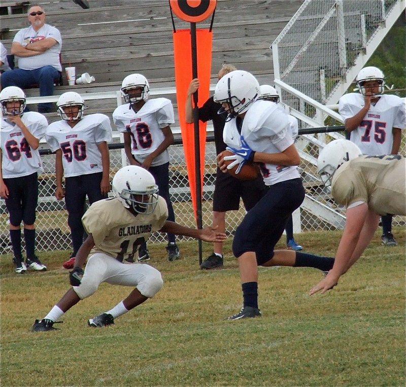 Image: Italy’s Kevin Johnson(18) prepares to tackle a two-legged Mustang.