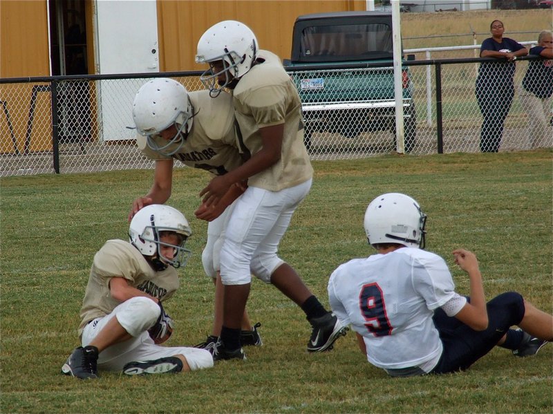 Image: Italy’s Levi McBride(28) gets congratulations from his teammates after intercepting the Mustang’s.