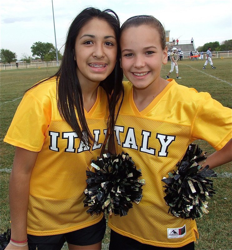 Image: IJH Cheerleaders Elizabeth Garcia and Paige Little add beauty to the brawn.