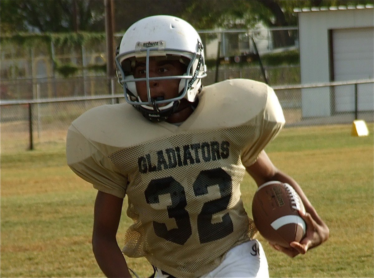 Image: Seeing the goal, Jaray Anderson(33) sprints in for the game tying touchdown.