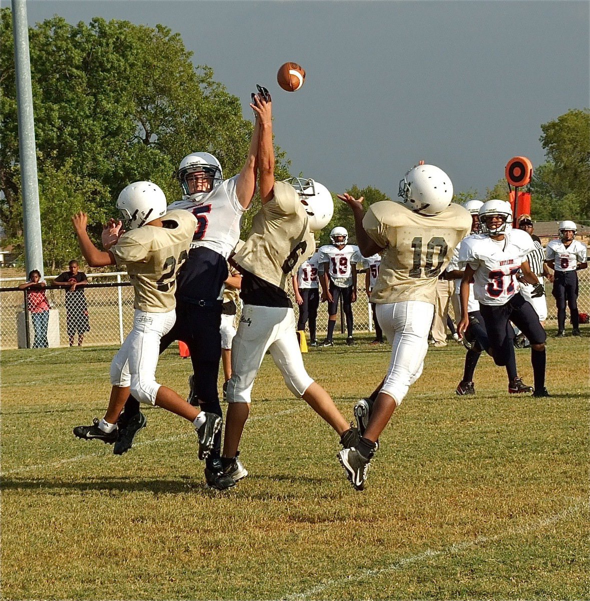 Image: Fabian Cortez(22) and Joe Celis(6) disrupt a Mustang pass attempt allowing Cameron Carter(10) to make the interception.