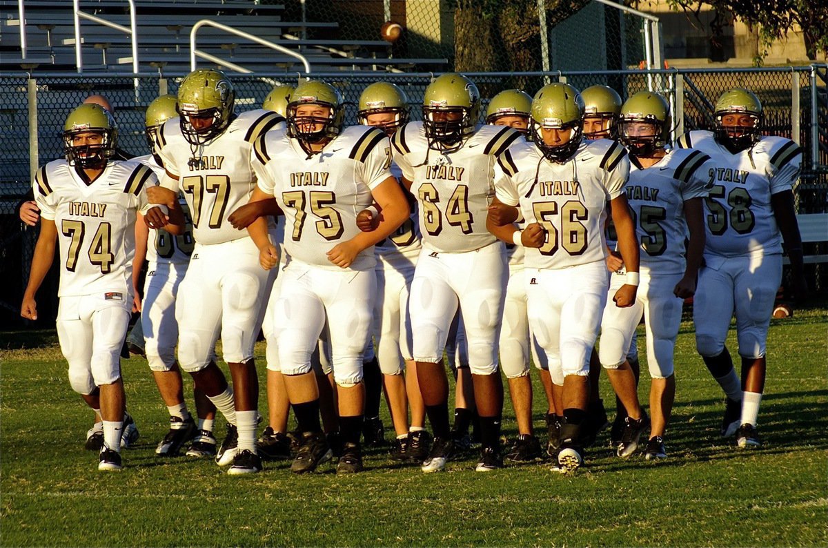 Image: In a display of team unity, the Gladiators emerge from the locker room as one.