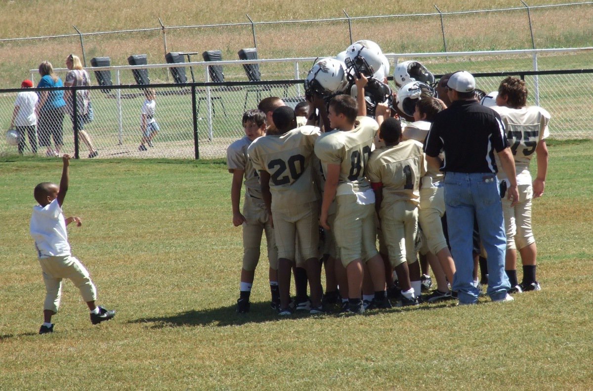 Image: C-team’s Curtis Benson rushes out to celebrate with the IYAA A-Team after their shutout victory.