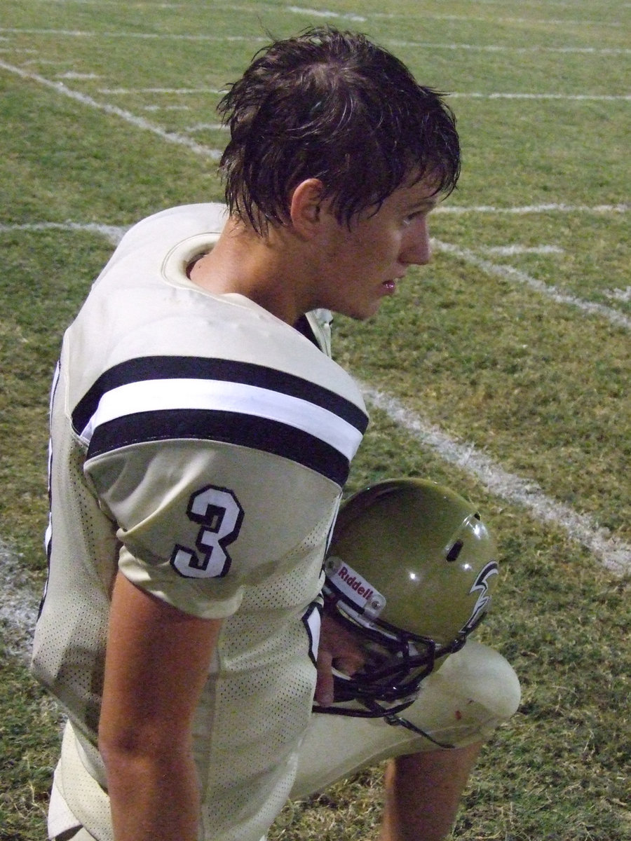 Image: Quarterback Jase Holden(3) checks the scoreboard at the end of the game.