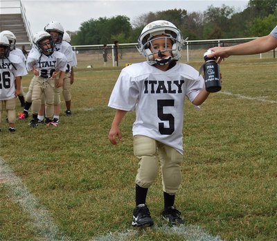 Image: Damien Wooldridge receives a squirt bottle and a football after the homecoming game against Hubbard.