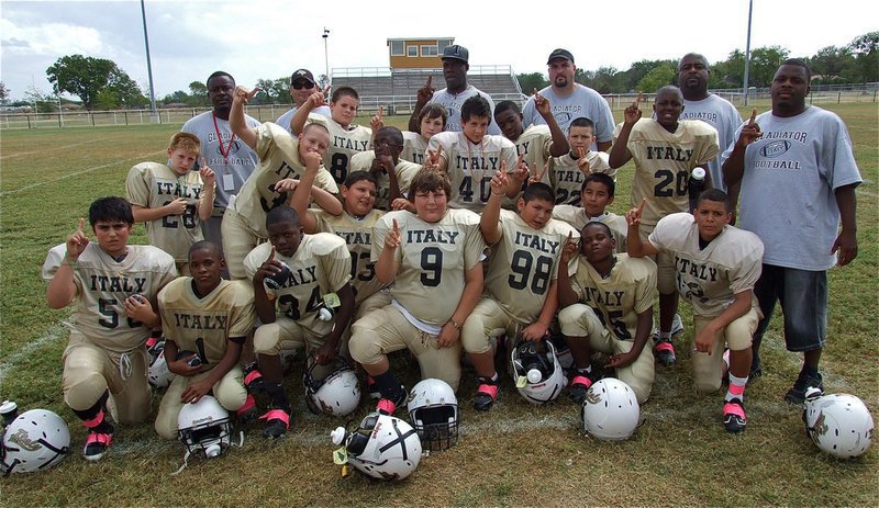 Image: The IYAA A-Team (4-0) poses for a team picture after their 32-6 Homecoming win over the Hubbard Jaguars.