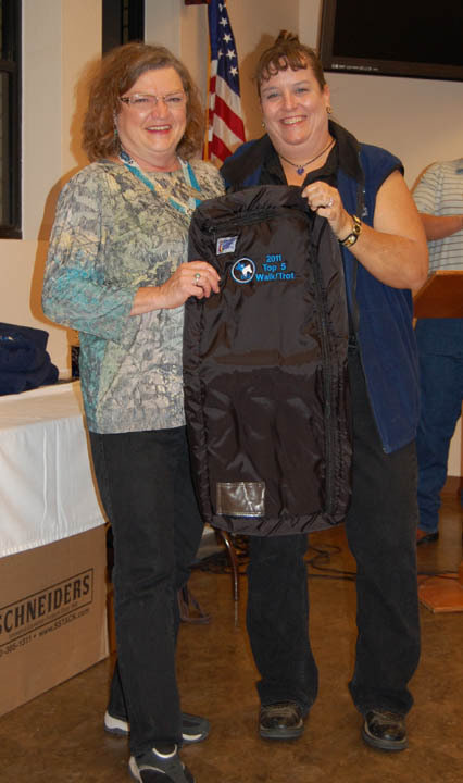 Image: Sandy Neal of Italy, left, won an award for Top 5 Walk/Trot Division.