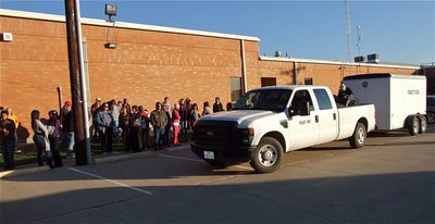 Image: Pulling out as the students and teachers cheer.