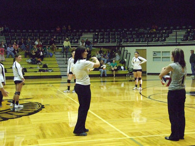 Image: One of the referees confers with Coach Richters about the Lady Gladiators’ rotation.