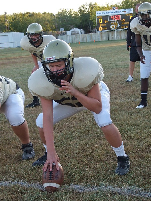 Image: JV Gladiator Bailey Walton(52) gets ready for the Cougars.