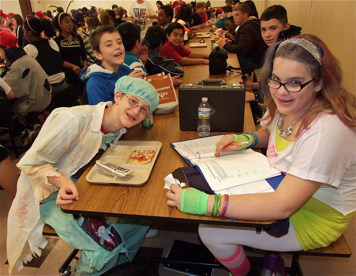 Image: Dr. Hunter Ballard confirms the cafeteria food is actually dead while Christy Tucker is an old-school hard working student.