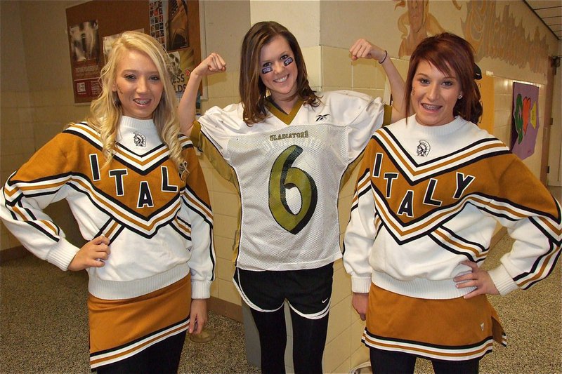 Image: Playing the role of Gladiator quarterback Jase Holden, is Kaitlyn Rossa. Playing the role of two Italy cheerleaders vying for his affection are Megan Richards and Bailey Bumpus.