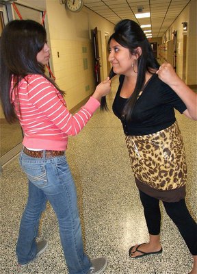 Image: Suzy “Snooky” Rodriguez goes crazy on unsuspecting IHS student, Alma Suaste.
