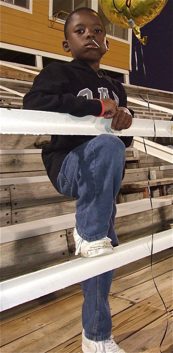 Image: Second grader Julius Williams, a football star for the Italy Youth Athletic Association (IYAA), is ready for the varsity matchup between Italy and Axtell.