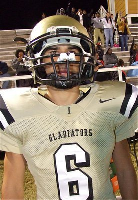 Image: Tony Wooldridge eyes the Longhorns across the field before the kickoff.