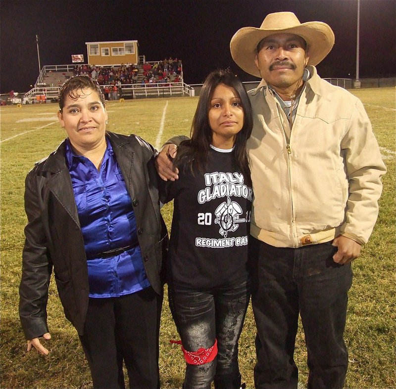 Image: Gladiator Regiment Marching Band member Laura Luna, a senior, is emotional as Italy prepares to play their final home game.