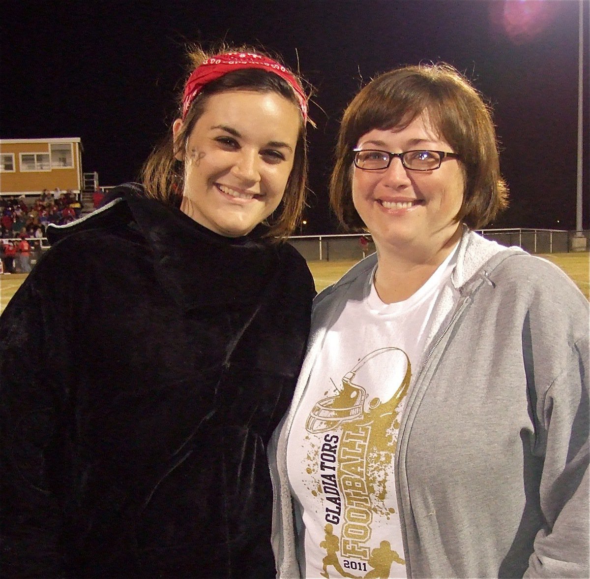 Image: Kaytlyn Bales, who played the role of the charging bull during the Gladiator Regiment Marching Band’s halftime show is pretty up-beat in her final home game as a senior while mom is a tad bit overcome.