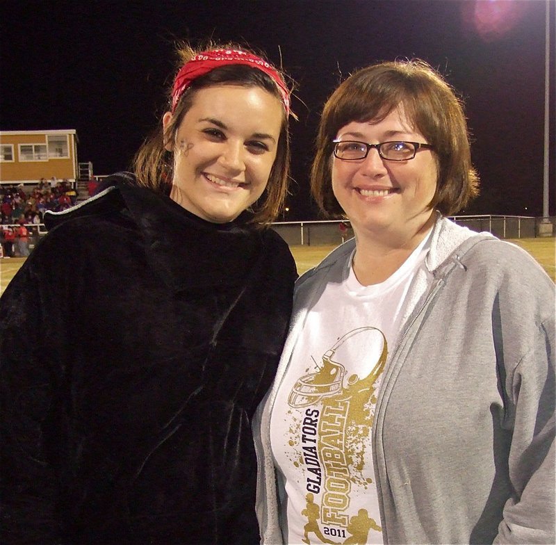 Image: Kaytlyn Bales, who played the role of the charging bull during the Gladiator Regiment Marching Band’s halftime show is pretty up-beat in her final home game as a senior while mom is a tad bit overcome.