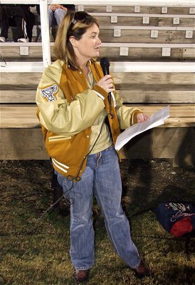 Image: Celebrating Senior Night at Willis Field, Tanya Snook who is the Director of Curriculum and Instruction, Federal Programs and Testing at Italy High School, introduces the senior class along with their escorts and reads individual farewell statements submitted by each senior before the game.