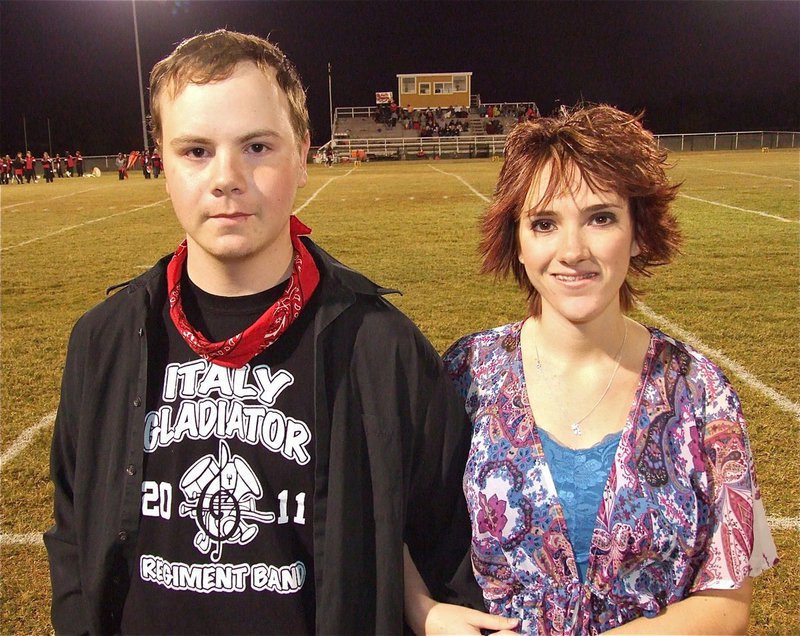 Image: Senior Gladiator Regiment Band Members, Nolan Griffith, and, Andrea Lanning, are introduced during the pre-game.