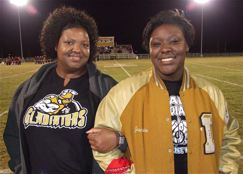 Image: Senior Lady Gladiator, Jimesha Reed keeps a smile. This will be her and her classmates final home football game to share together. 