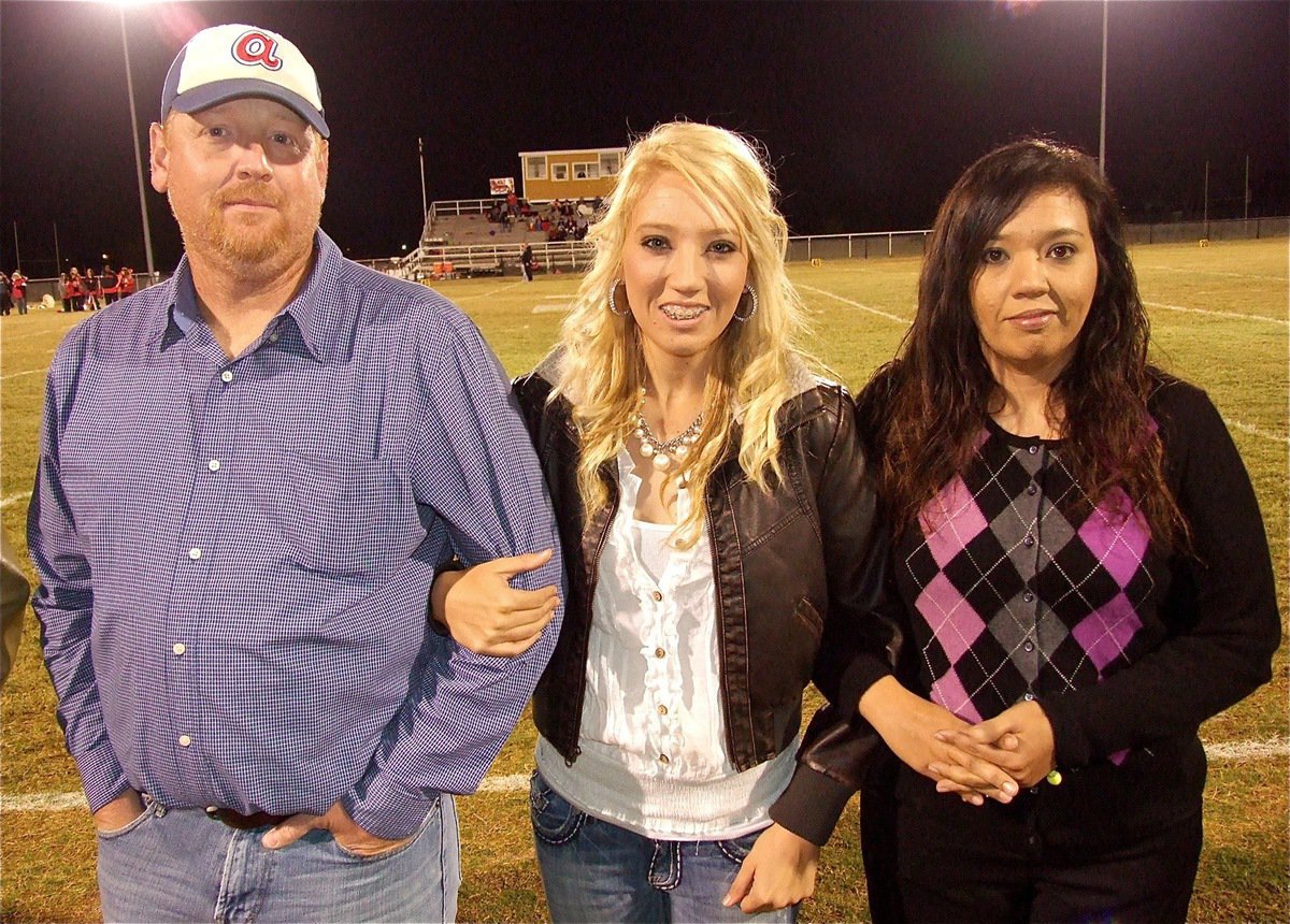 Image: Senior Lady Gladiator, Megan Richards, represents the Lady Gladiator Volleyball team during the pre-game introductions.