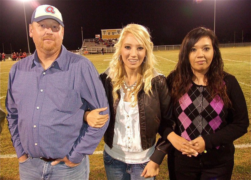 Image: Senior Lady Gladiator, Megan Richards, represents the Lady Gladiator Volleyball team during the pre-game introductions.