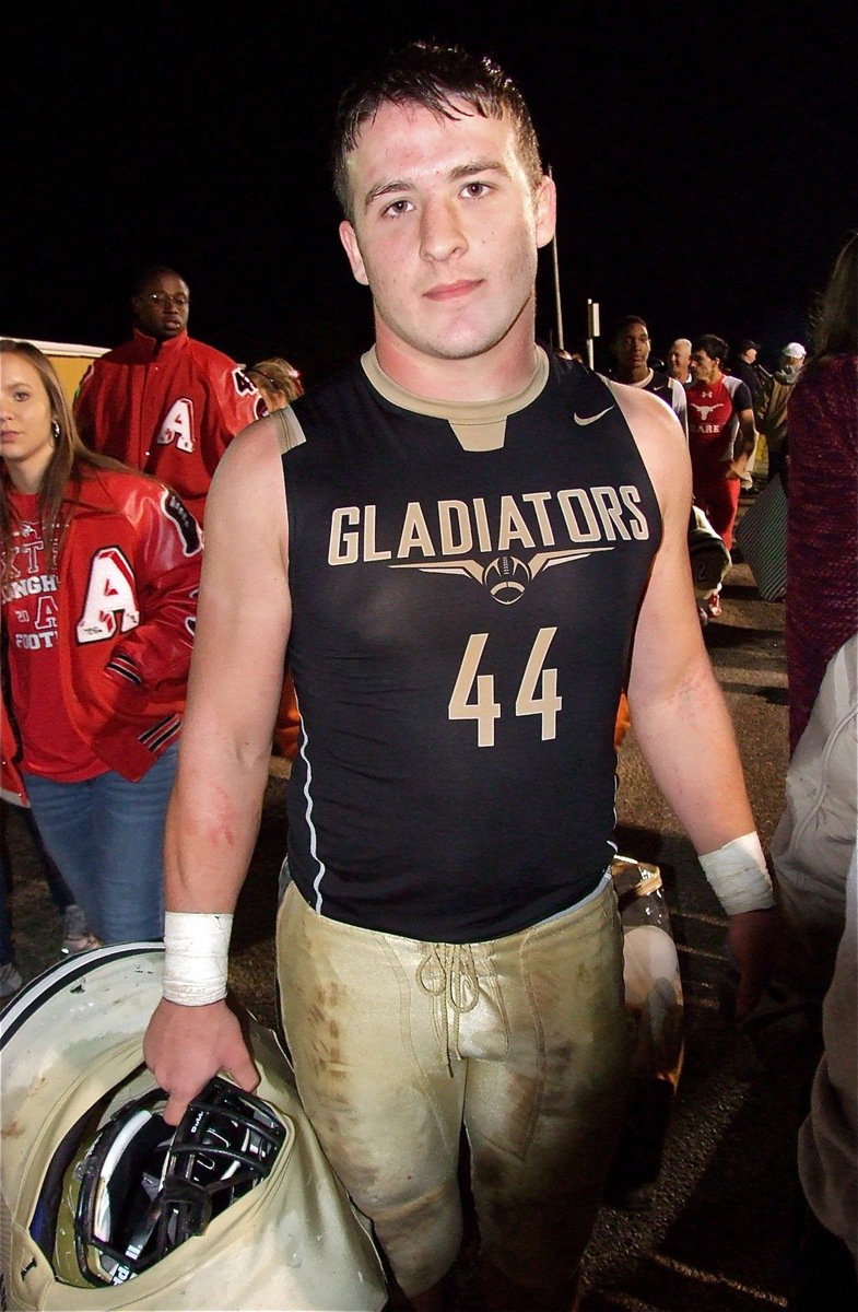 Image: Senior Gladiator, Ethan Saxon(44) makes his way thru the mob and toward the field house after Italy’s 36-26 win over Axtell.