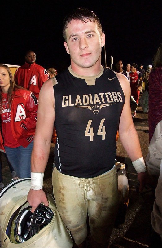 Image: Senior Gladiator, Ethan Saxon(44) makes his way thru the mob and toward the field house after Italy’s 36-26 win over Axtell.