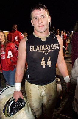 Image: Senior Gladiator, Ethan Saxon(44) makes his way thru the mob and toward the field house after Italy’s 36-26 win over Axtell.