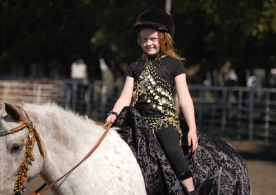 Image: Sadie Hinz of Italy won the “Most Glamorous” prize in the costume contest for dressing herself and her horse as an Arabian Princess.