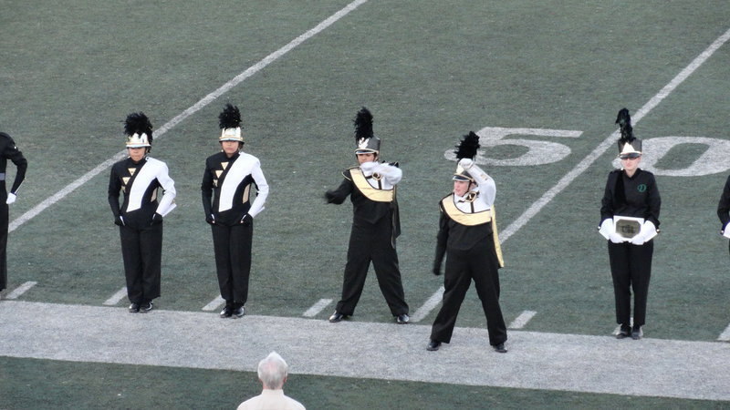 Image: Drum Major Drenda Burk and assistant Drum Major Cruz Enriquez salute as the top finalists are named.