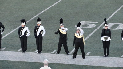Image: Drum Major Drenda Burk and assistant Drum Major Cruz Enriquez salute as the top finalists are named.