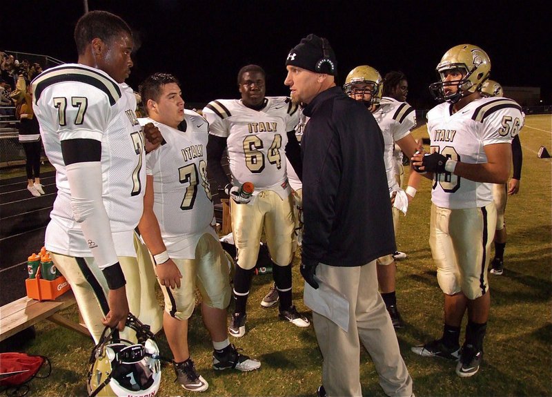 Image: Gladiator assistant coach Jeff Richters talks strategy with Italy’s offensive line, consisting of Larry Mayberry, Jr.(77), Isaac Medrano(70), Adrian Reed(64), Zain Byers(50) and Omar Estrada(56).