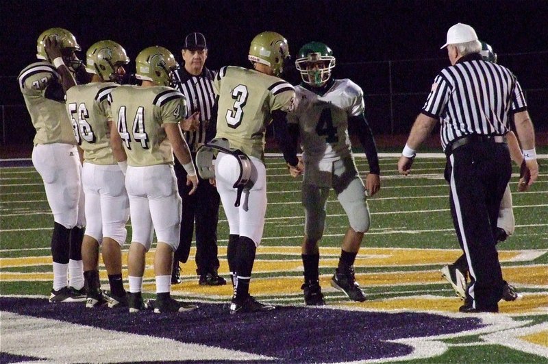 Image: Gladiator Captains Larry Mayberry, Jr., Omar Estrada(56), Ethan Saxon(44) and Jase Holden(3) greet the Lion captains.