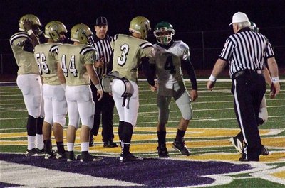 Image: Gladiator Captains Larry Mayberry, Jr., Omar Estrada(56), Ethan Saxon(44) and Jase Holden(3) greet the Lion captains.