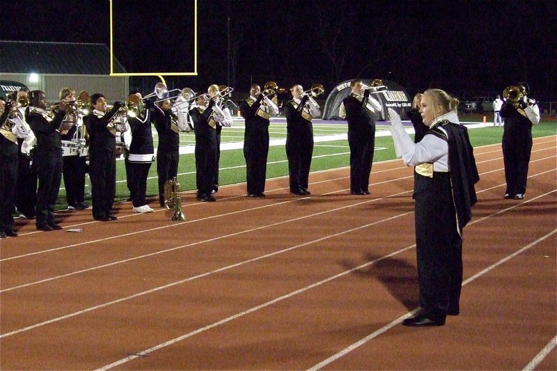 Image: Gladiator Regiment Band drum major Drenda Burk leads her talented troops.