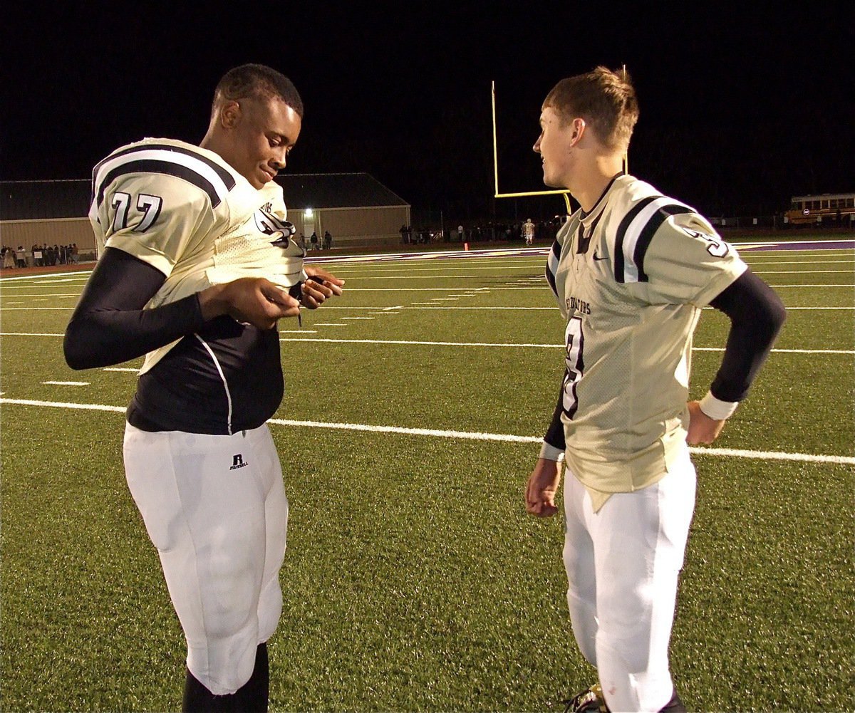 Image: Seniors manage a smile. Larry and Jase have tons to smile about despite their team’s loss to Franklin. After all, a co-district championship and finishing as a bi-district finalist is something to smile about.