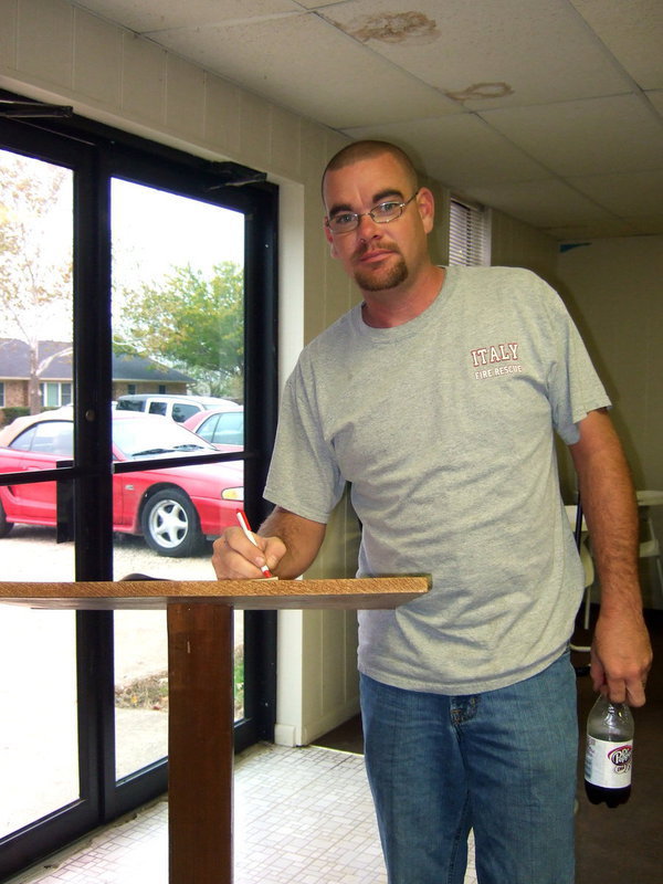 Image: Brad Chambers (Italy volunteer fireman) signing in and ready to share breakfast with the city employees.