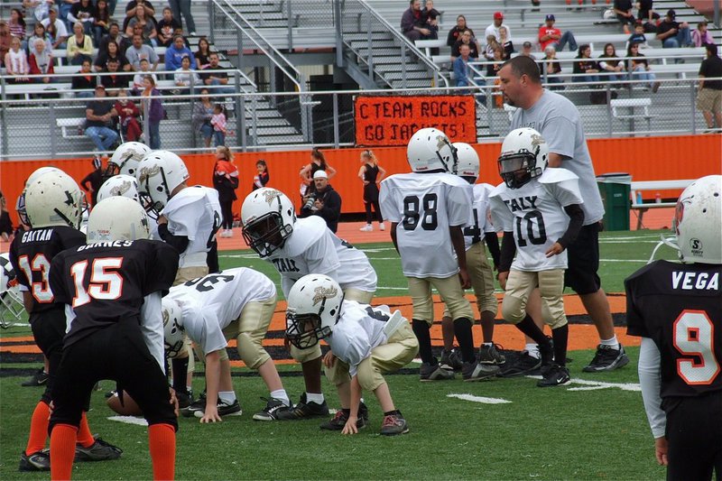 Image: Coach Itson breaks the huddle with his troops.