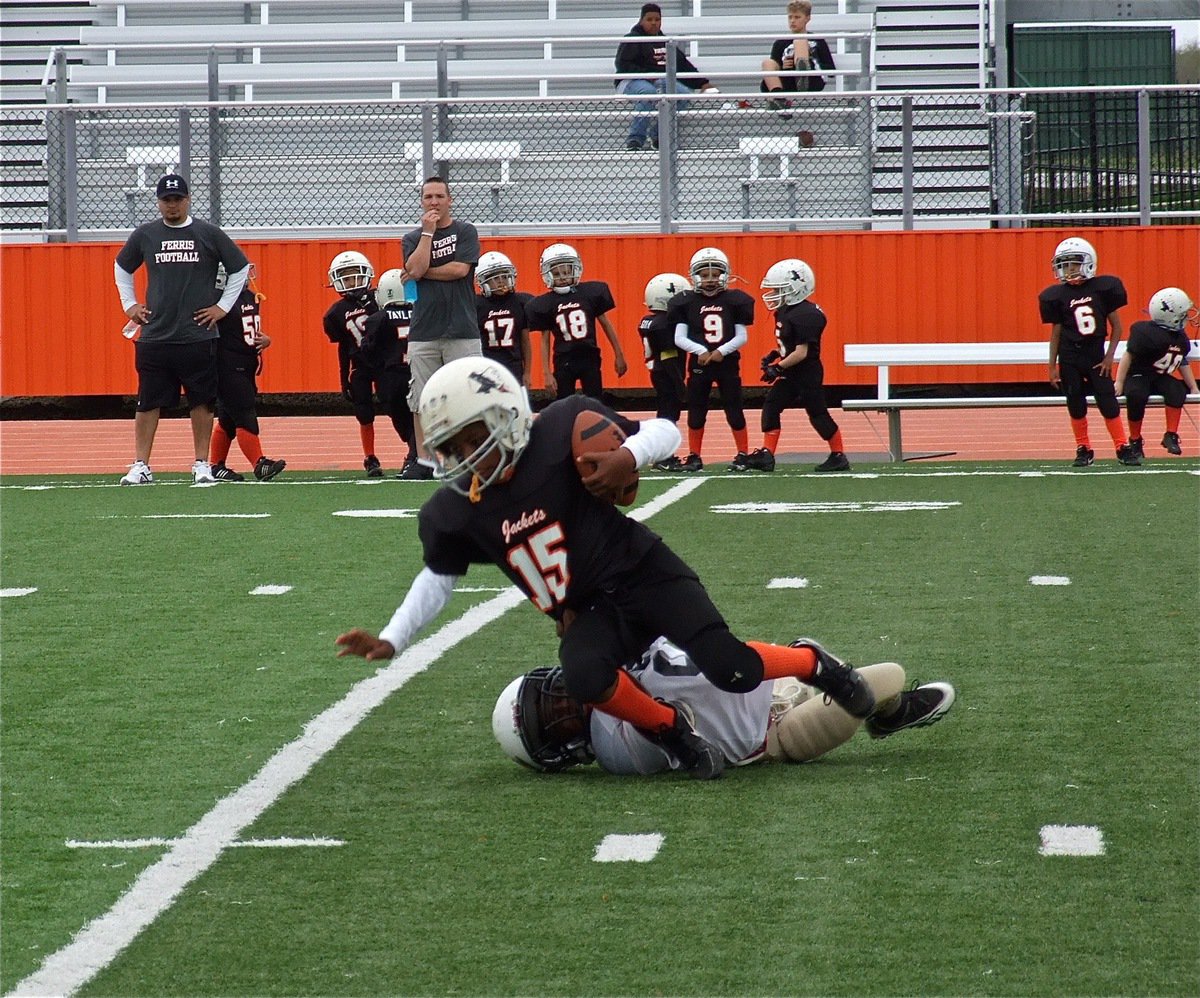Image: Defensive end John Hall, Jr.(9) brings down the main weapon for Ferris recording a tackle for a 6-yard loss on the play. 